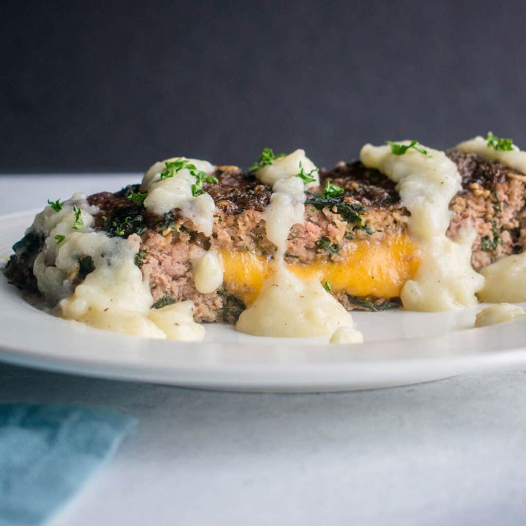 plate of meatloaf with cheddar and potato gravy
