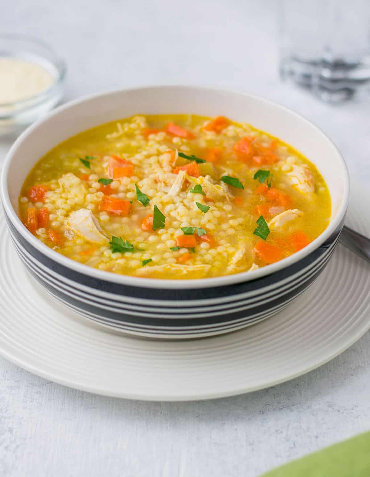 closeup of bowl of chicken soup with pastina