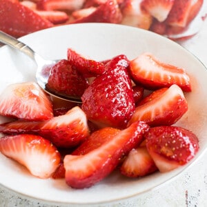 strawberries in small bowl with spoonful