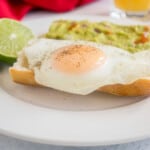 basted egg on bread with lime and guacamole toast