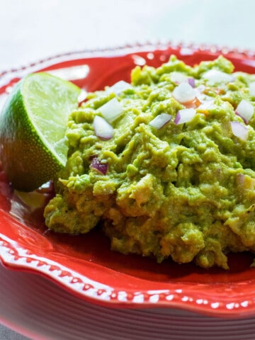 guacamole on red plate
