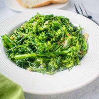 cooked rapini in white bowl