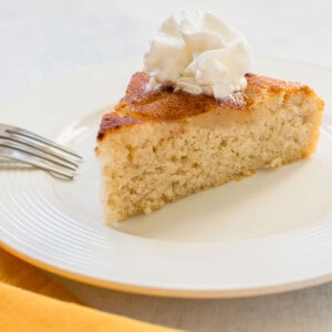 slice of pear cake with whipped cream