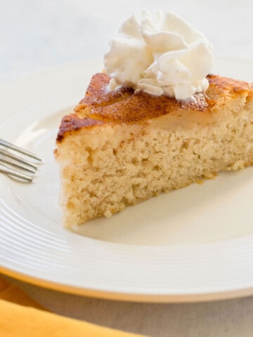 slice of pear cake with whipped cream