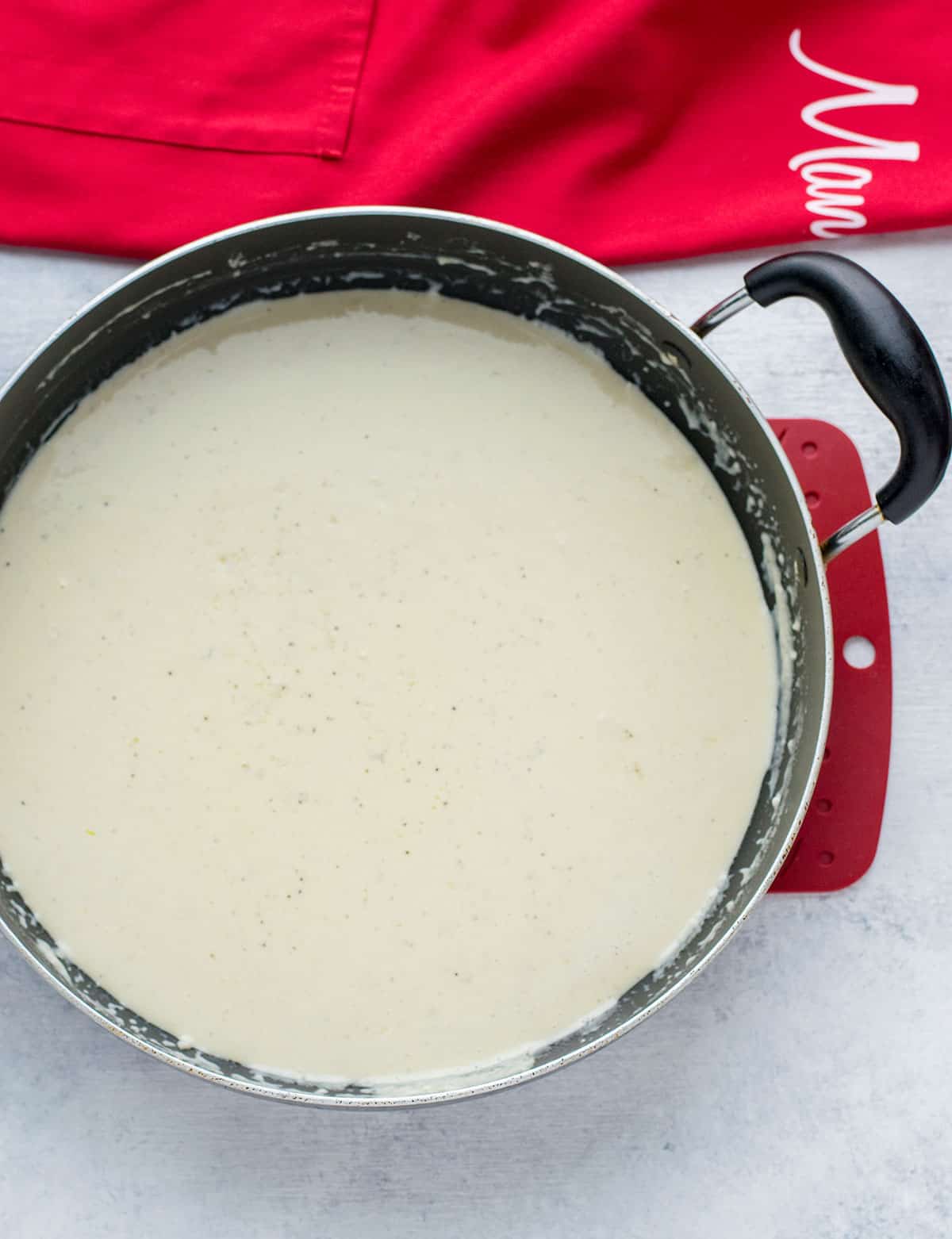 creamy white sauce in pan