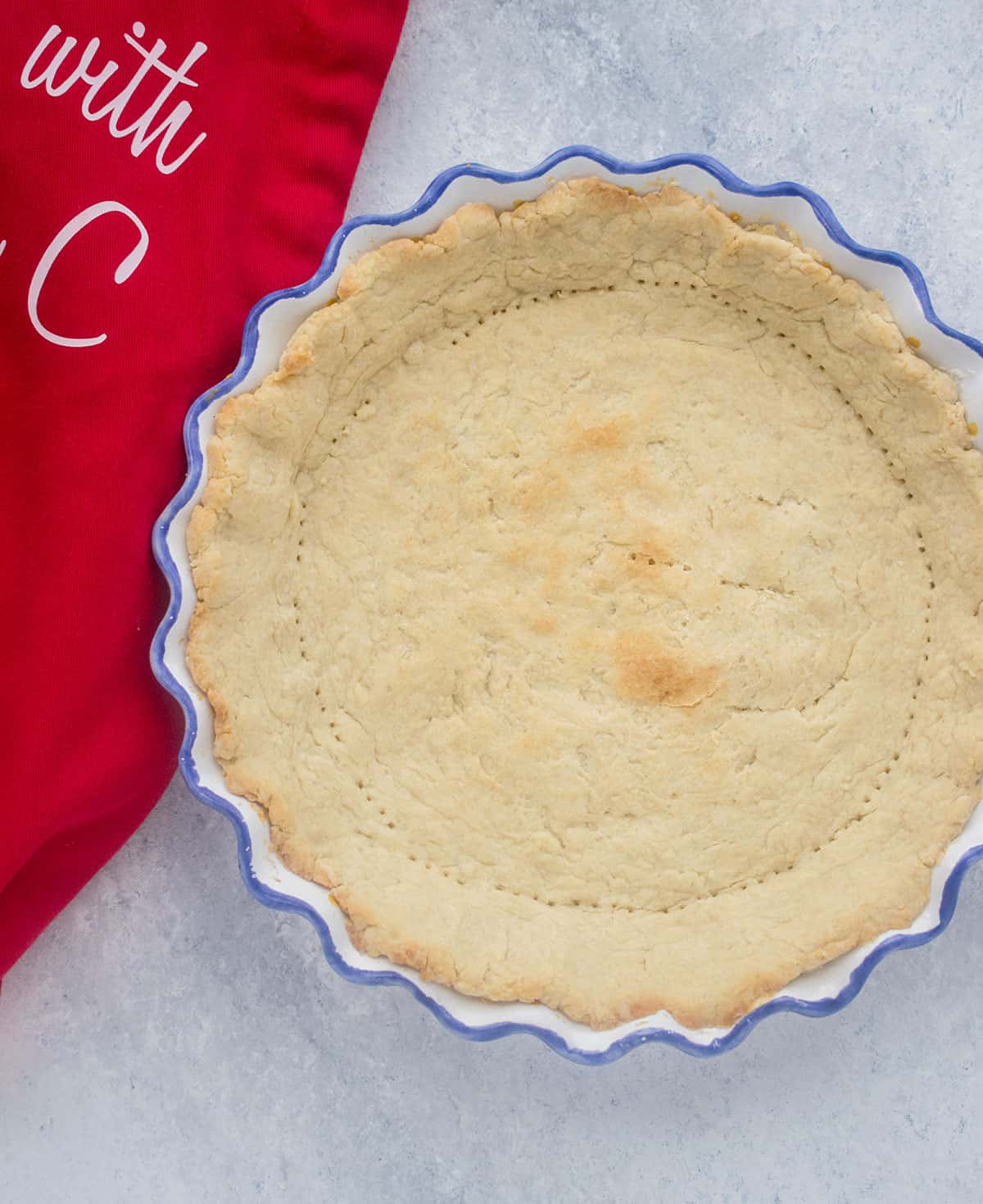 baked pie crust, red apron