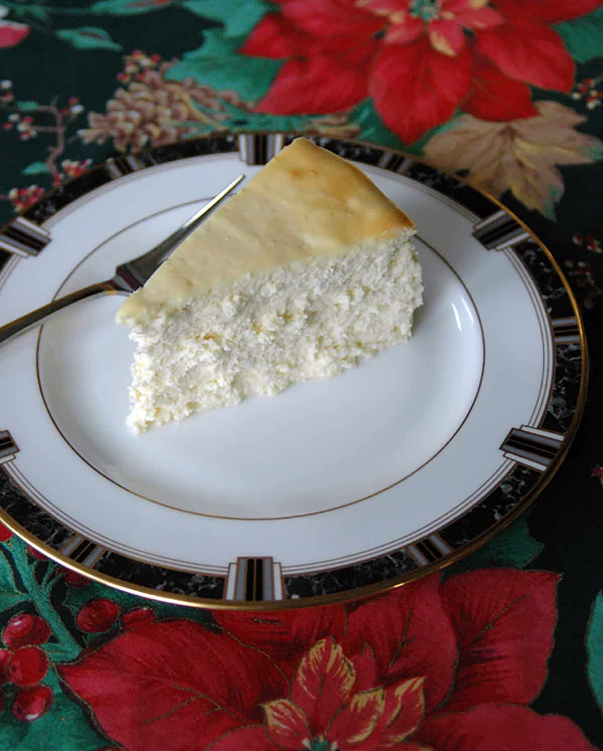 slice of cheesecake on plate with fork
