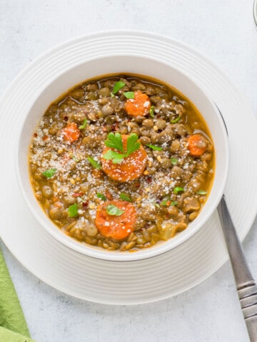 bowl of lentil soup with spoon.