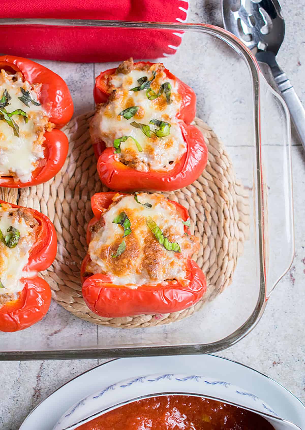 baked stuffed peppers with tomato sauce on side