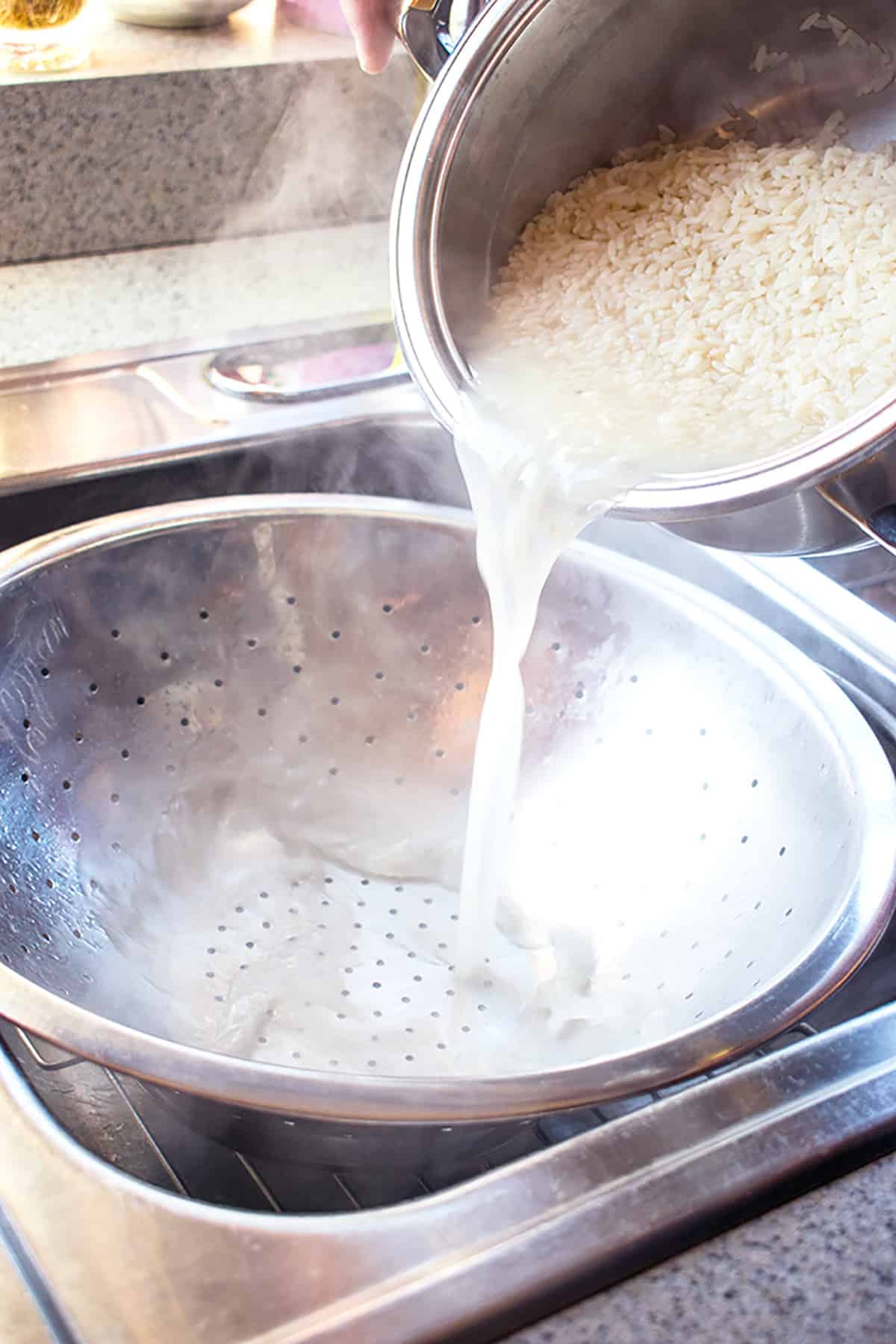 draining rice in colander
