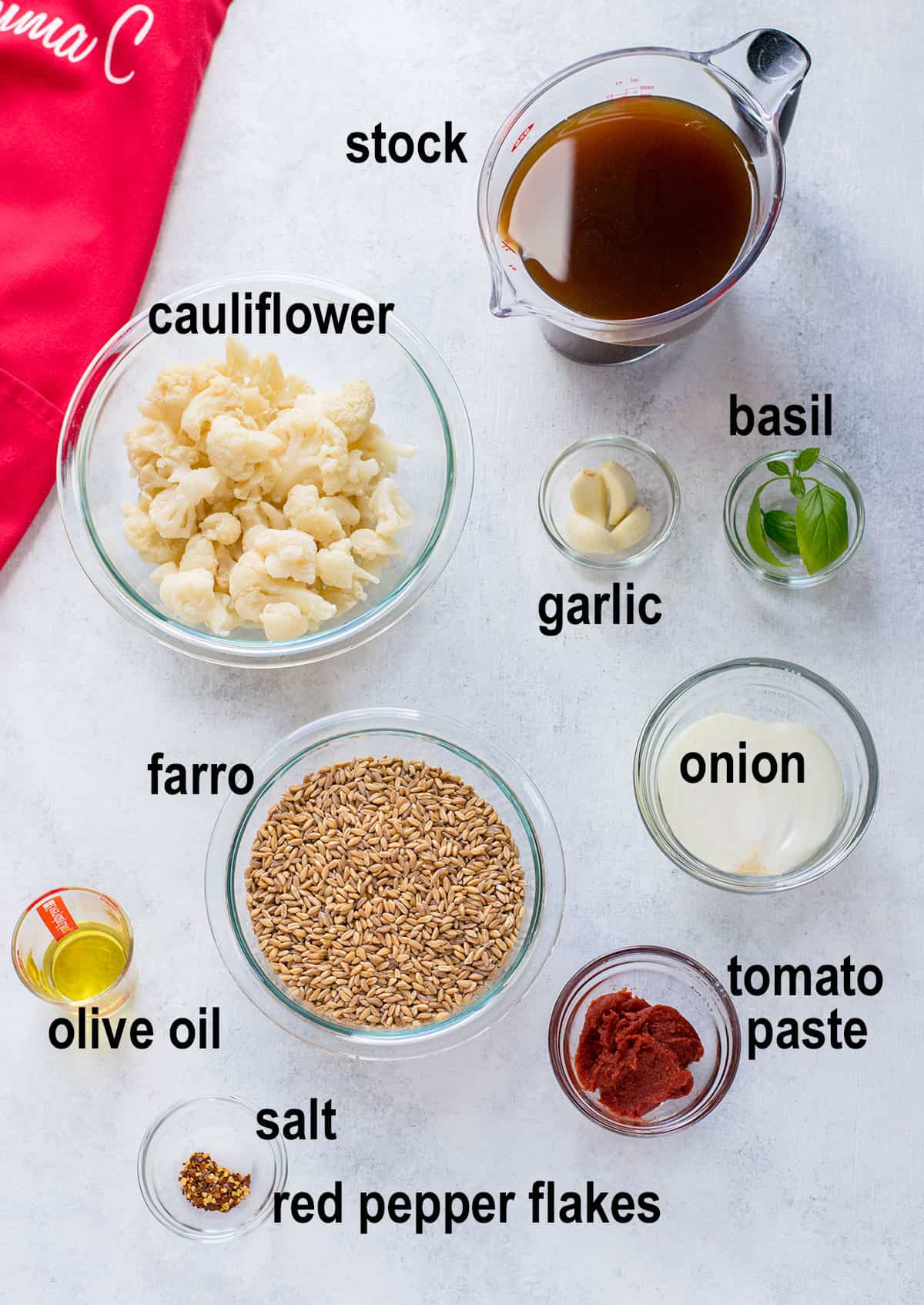 dry farro, cauliflower florets, stock, onion, garlic, tomato paste, oil, basil, seasonings