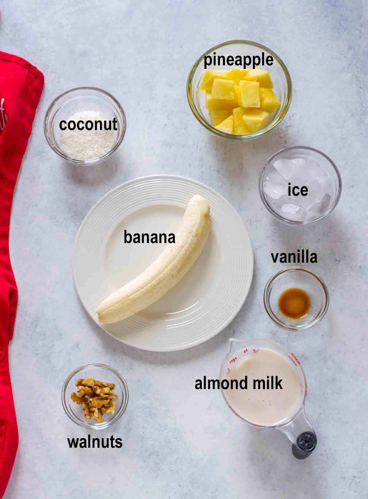 banana, pineapple chunks, almond milk, vanilla, walnuts, coconut, ice