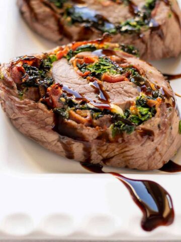 steak pinwheel with bacon, spinach and balsamic glaze.