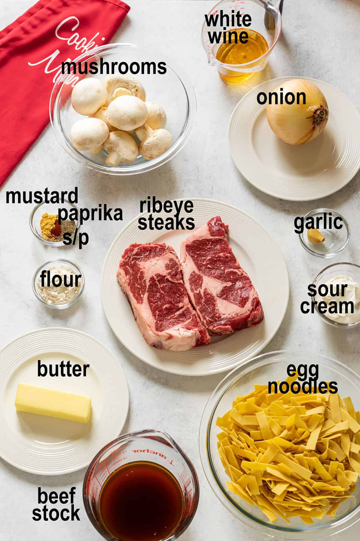 raw steak, noodles, wine, beef stock, mushrooms, onions, sour cream, seasonings