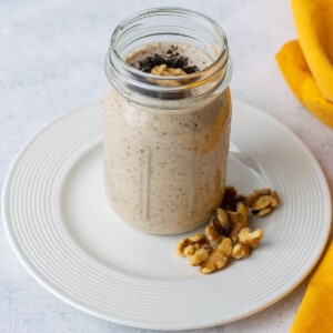 espresso smoothie in a mason jar on a plate.