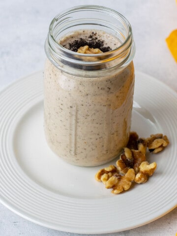 espresso smoothie in a mason jar on a plate.