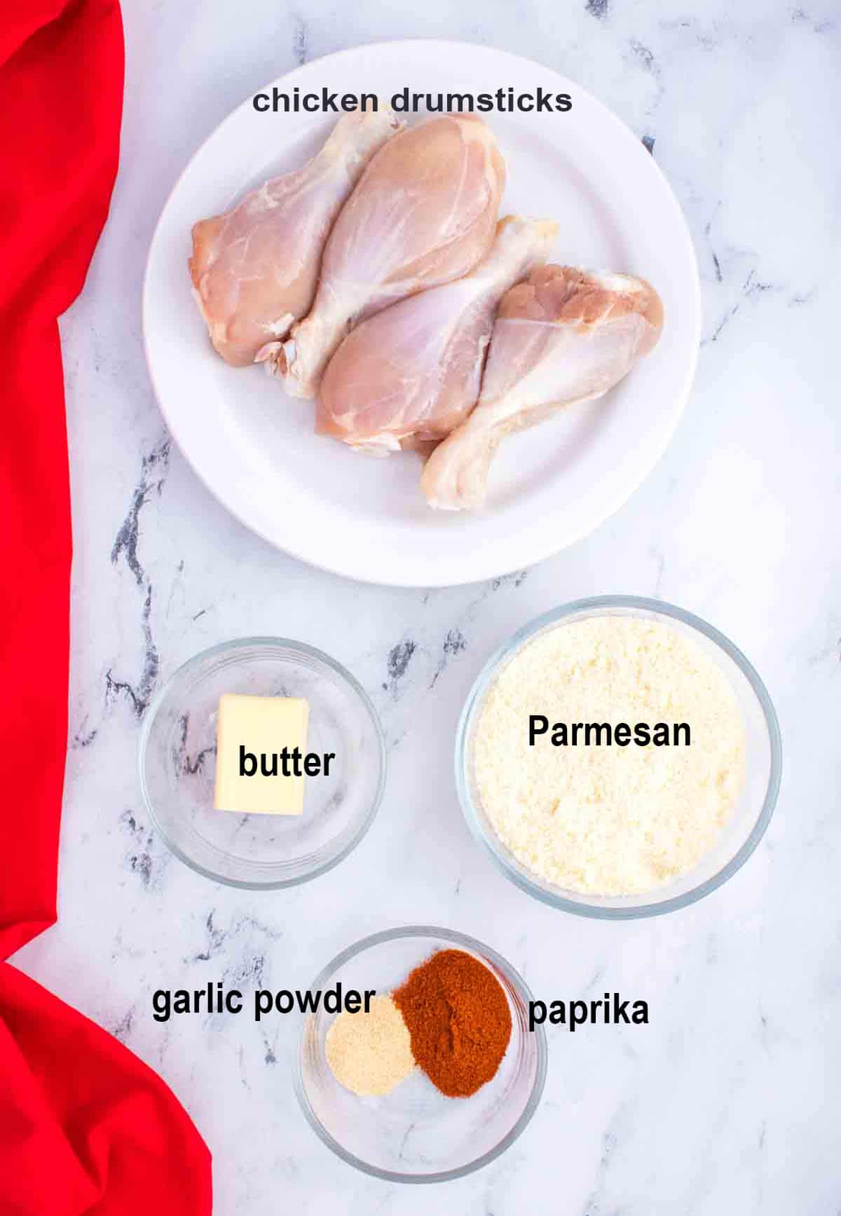raw chicken drumsticks, butter, Parmesan, seasonings