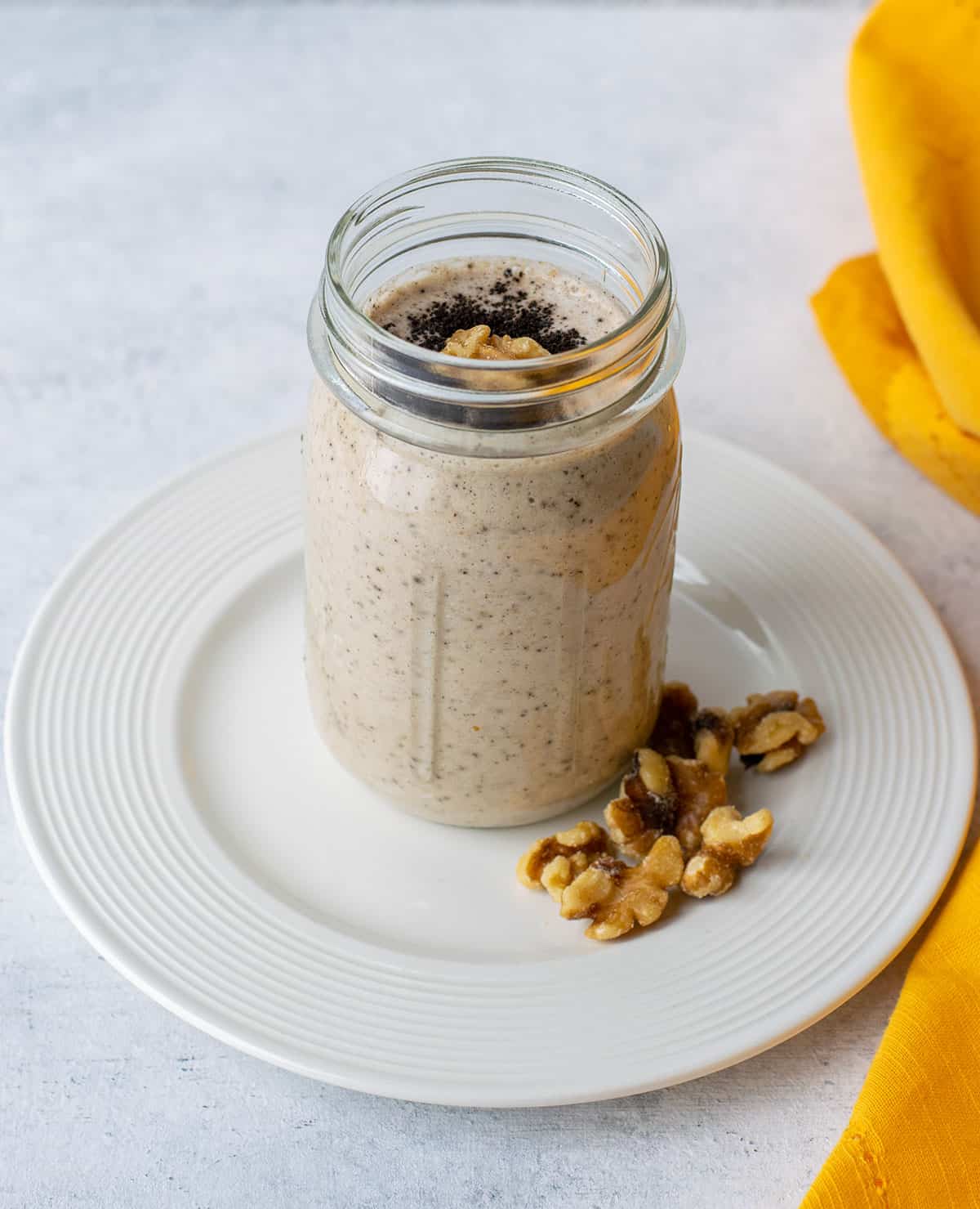 espresso smoothie in a mason jar on a plate.