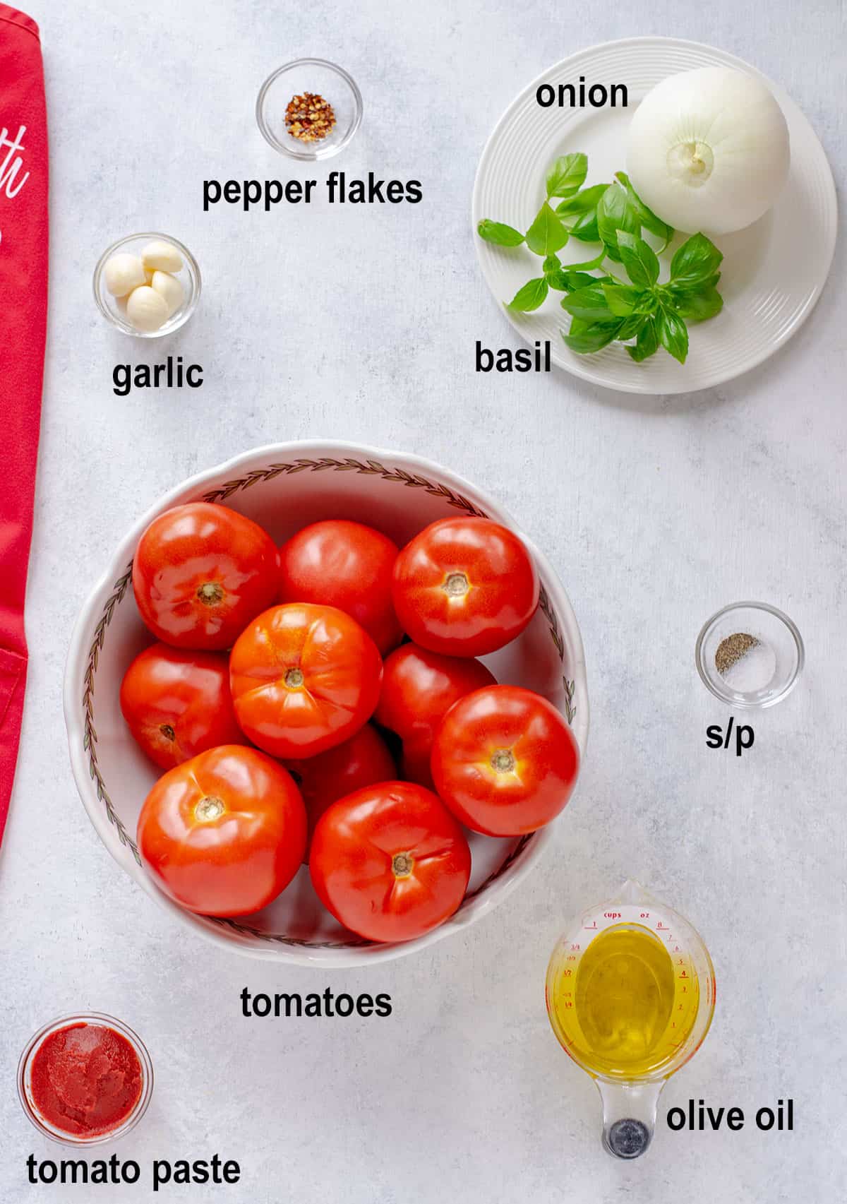 tomatoes, oil, tomato paste. garlic, onion, basil, salt, pepper, pepper flakes.