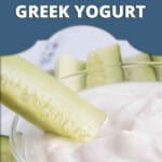 Pin image for Ranch Dressing with Greek Yogurt by Cooking with Mamma C. Cucumber stick being dipped in a bowl of ranch dressing.
