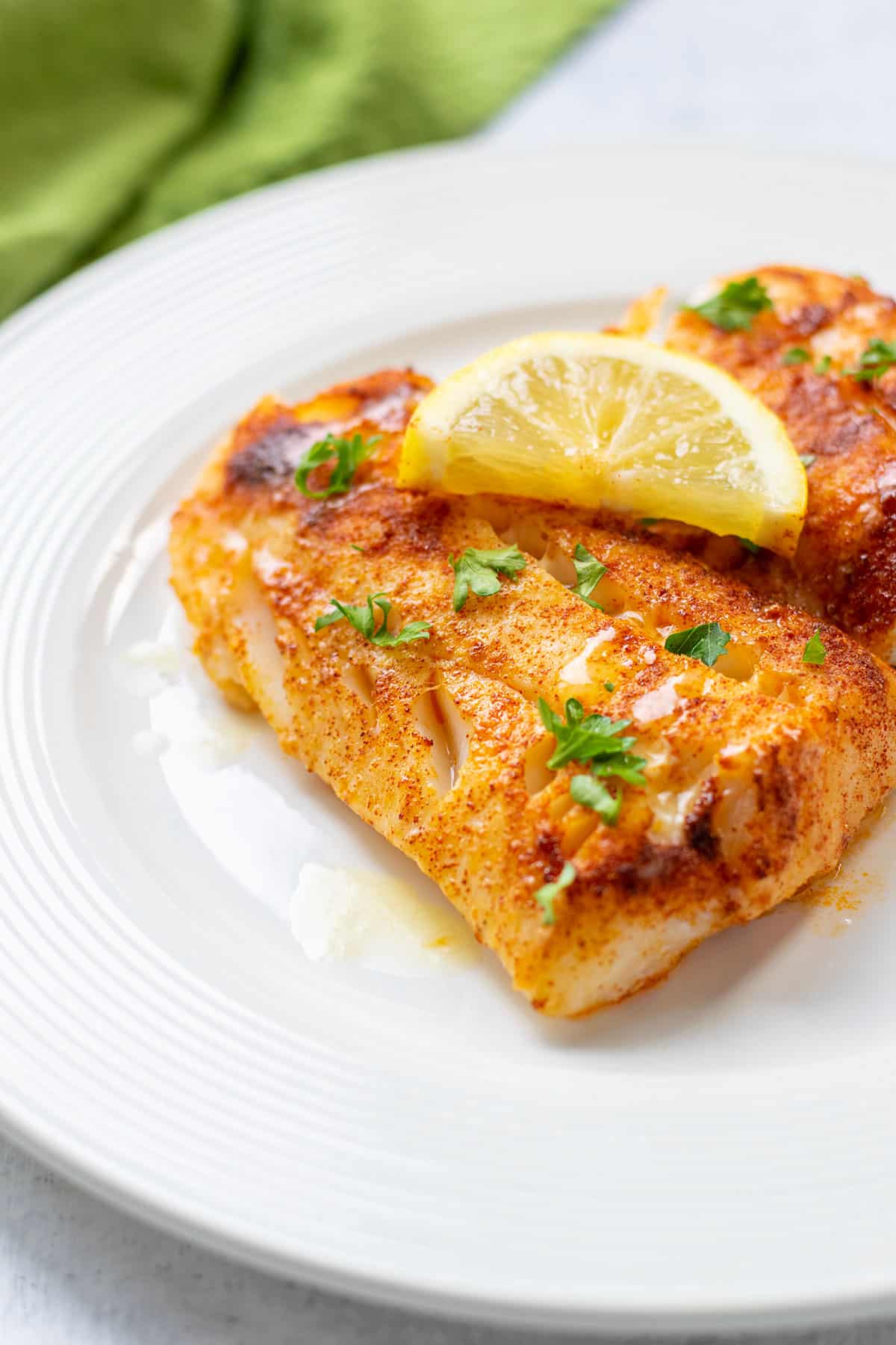 grilled, seasoned cod with butter, lemon and parsley.