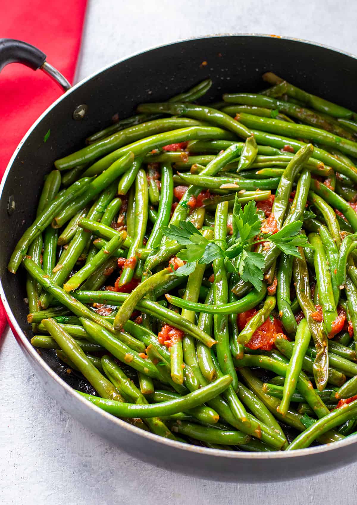 skillet of green beans with tomatoes