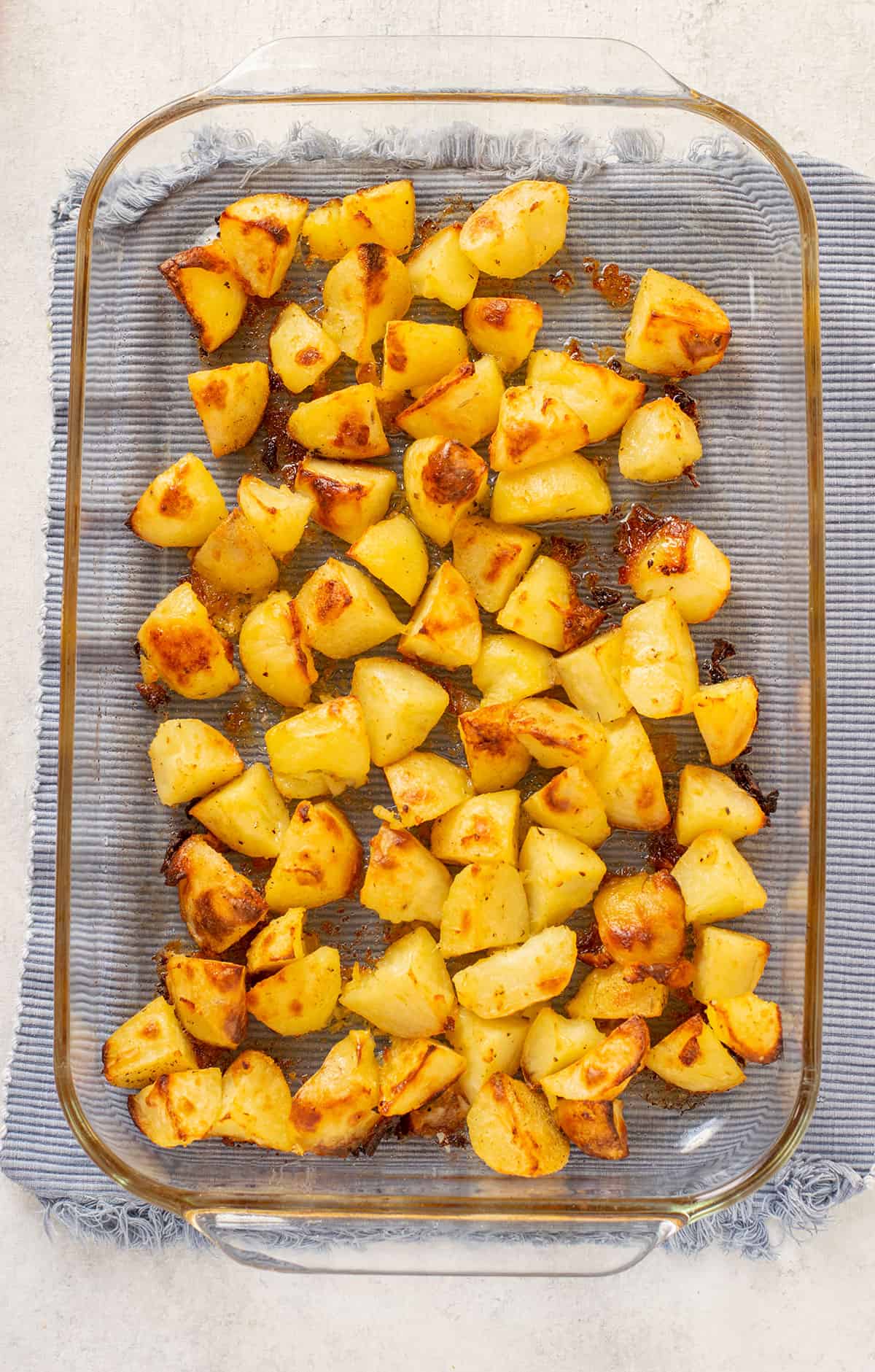 roasted potatoes in a glass pan