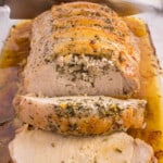 roasted pork loin in pan partially sliced