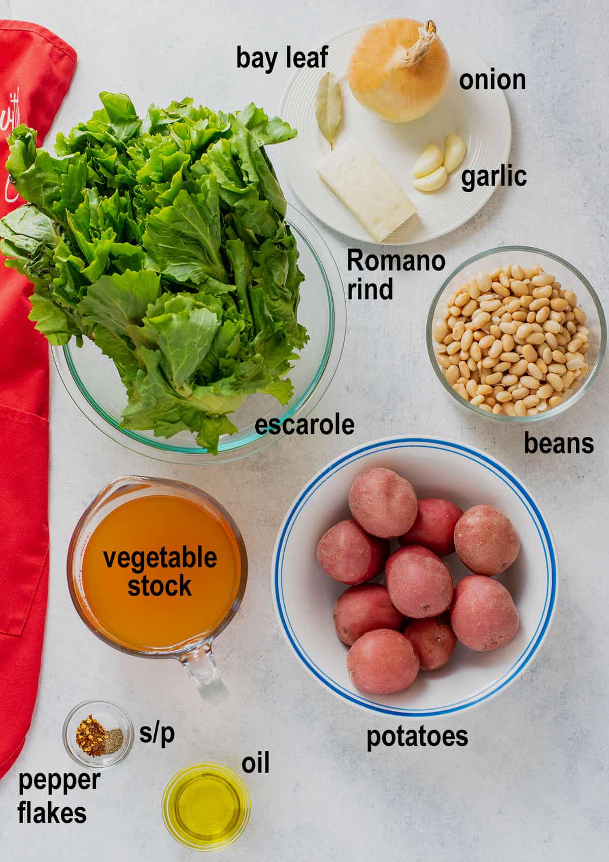 bay leaf, onion, garlic, Romano rind, escarole, beans, vegetable stock, potatoes, spices, oil.