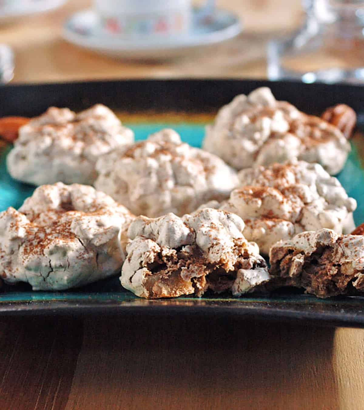 meringue cookies with cocoa sprinkles on plate