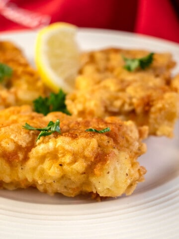 plate of fried baccalà (salted cod fish) garnished with parsley