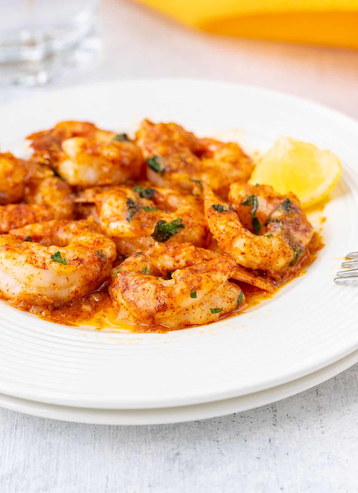 plate of garlic parmesan shrimp with butter sauce