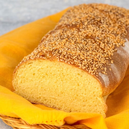 loaf of bread sliced open topped with sesame seeds