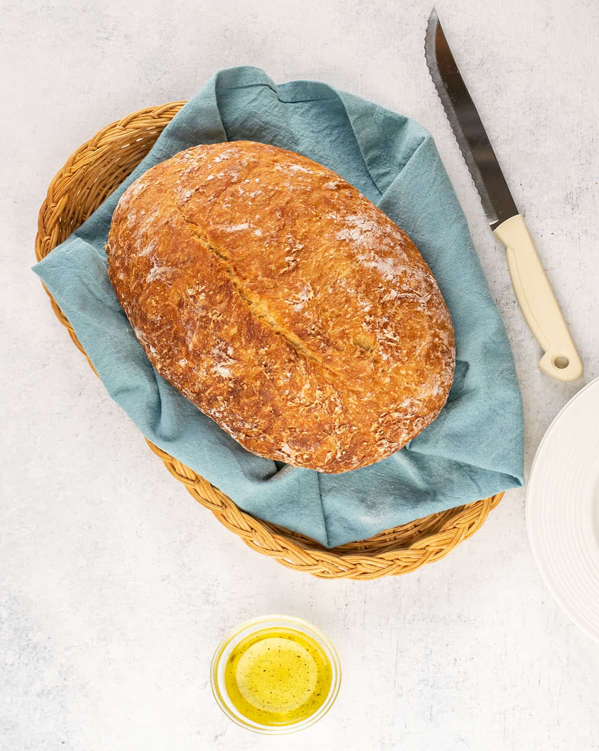 loaf of crusty italian bread in a bread basket