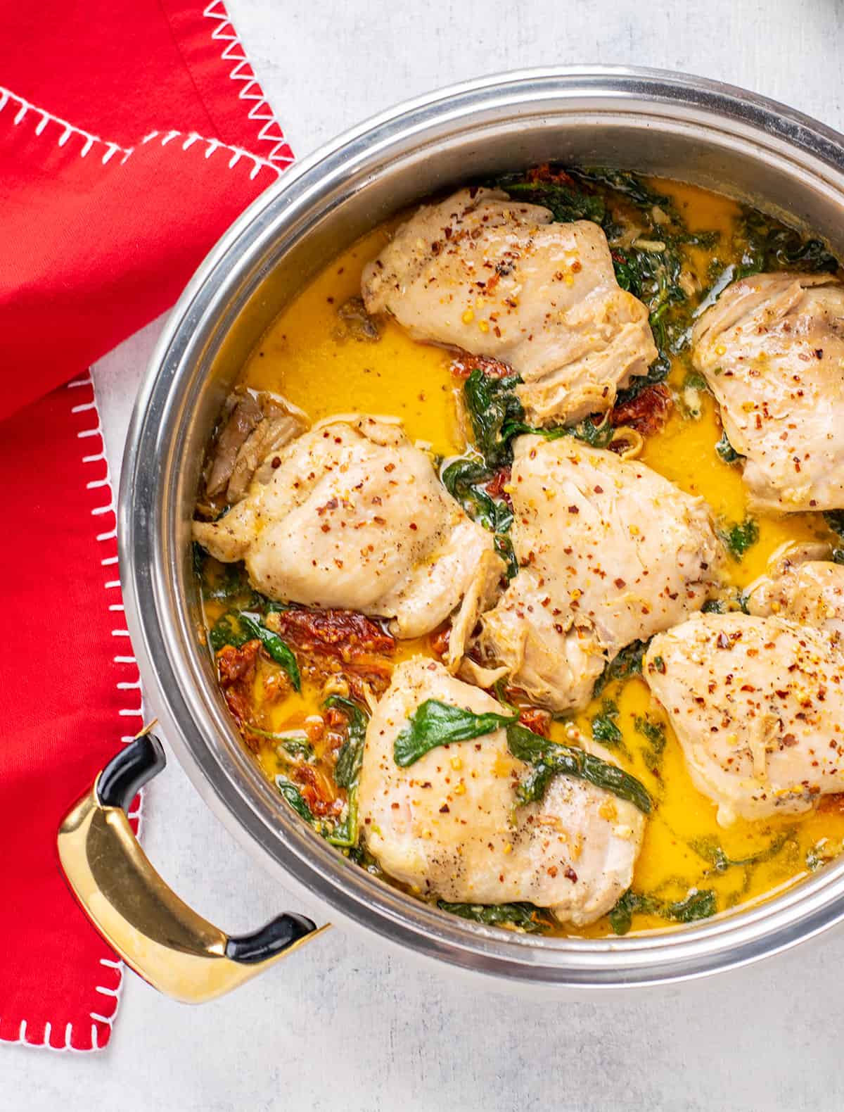 pan of chicken thighs with sun-dried tomato cream sauce