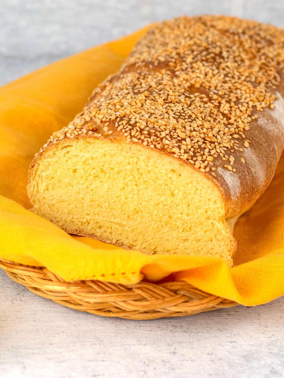 loaf of bread sliced open topped with sesame seeds