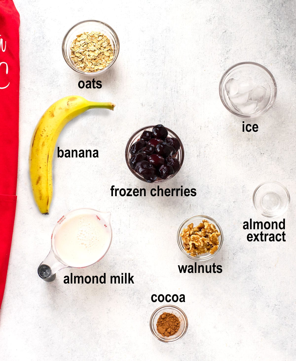oats, ice, banana, frozen cherries, almond milk, almond extract, walnuts, cocoa