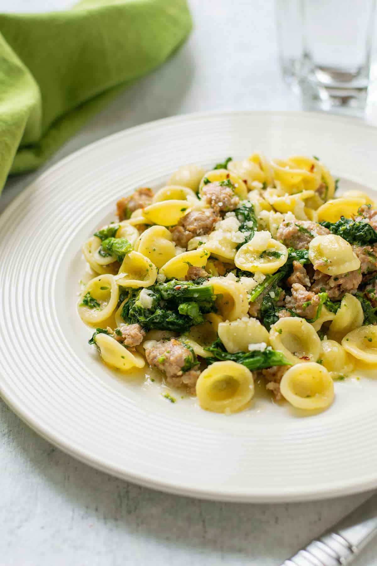 dish of orecchiette pasta with sausage and rapini (broccoli rabe)