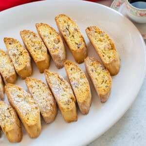 platter of almond biscotti sprinkled with powdered sugar