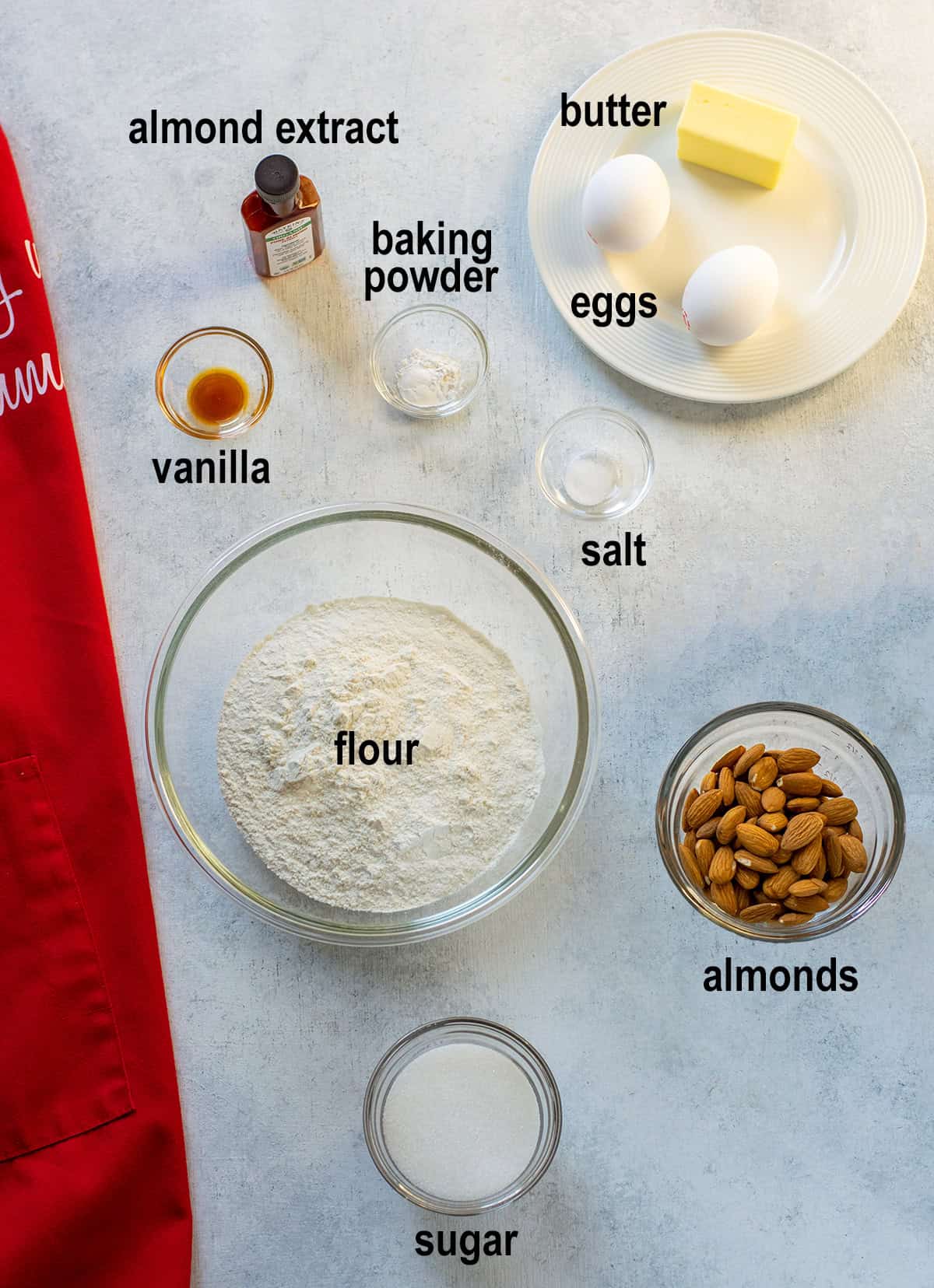 almond extract, butter, baking powder, eggs, vanilla, salt, flour, almonds, sugar