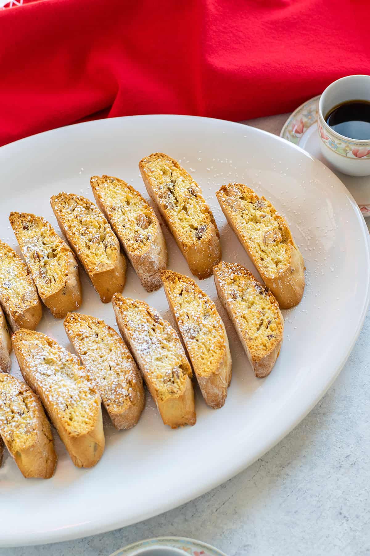 platter of almond biscotti sprinkled with powdered sugar