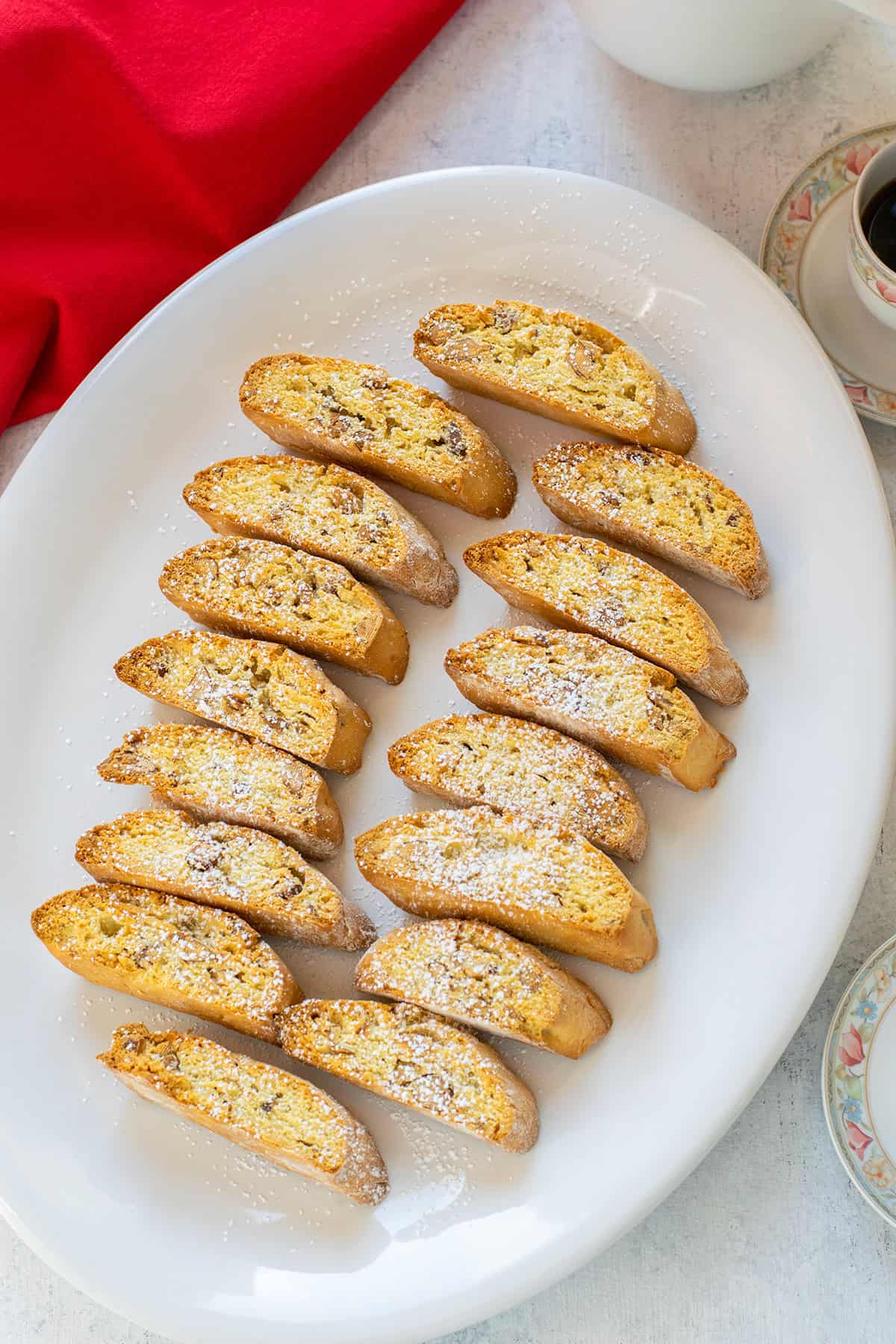 platter of almond biscotti sprinkled with powdered sugar