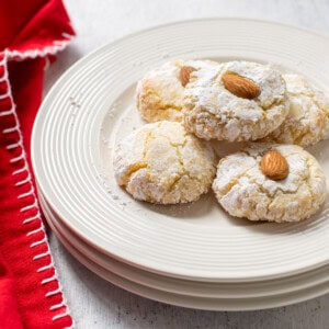 plate of amaretti cookies topped with almonds