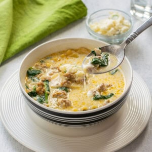 bowl of white lasagna soup topped with ricotta