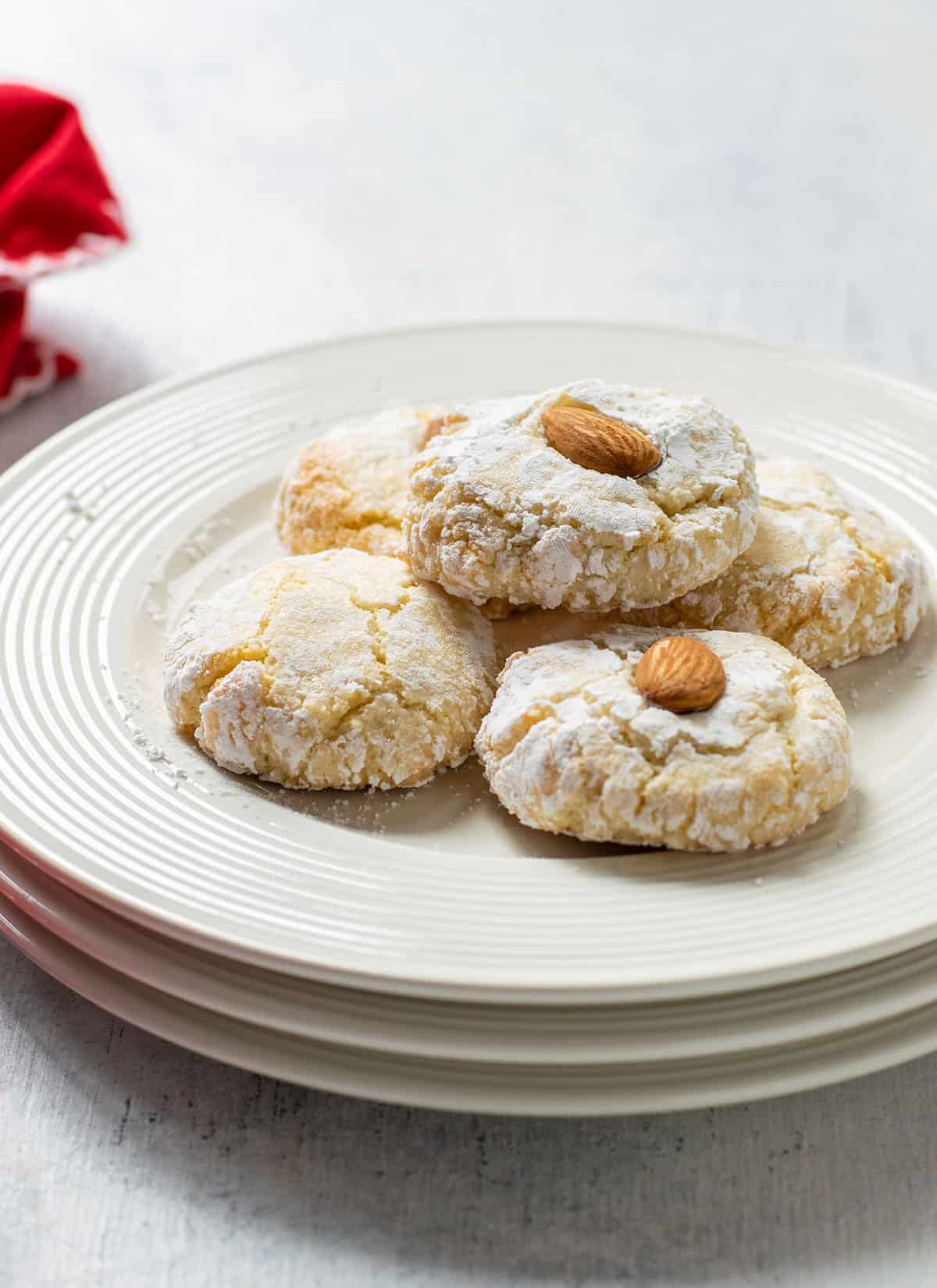 plate of amaretti cookies topped with almonds