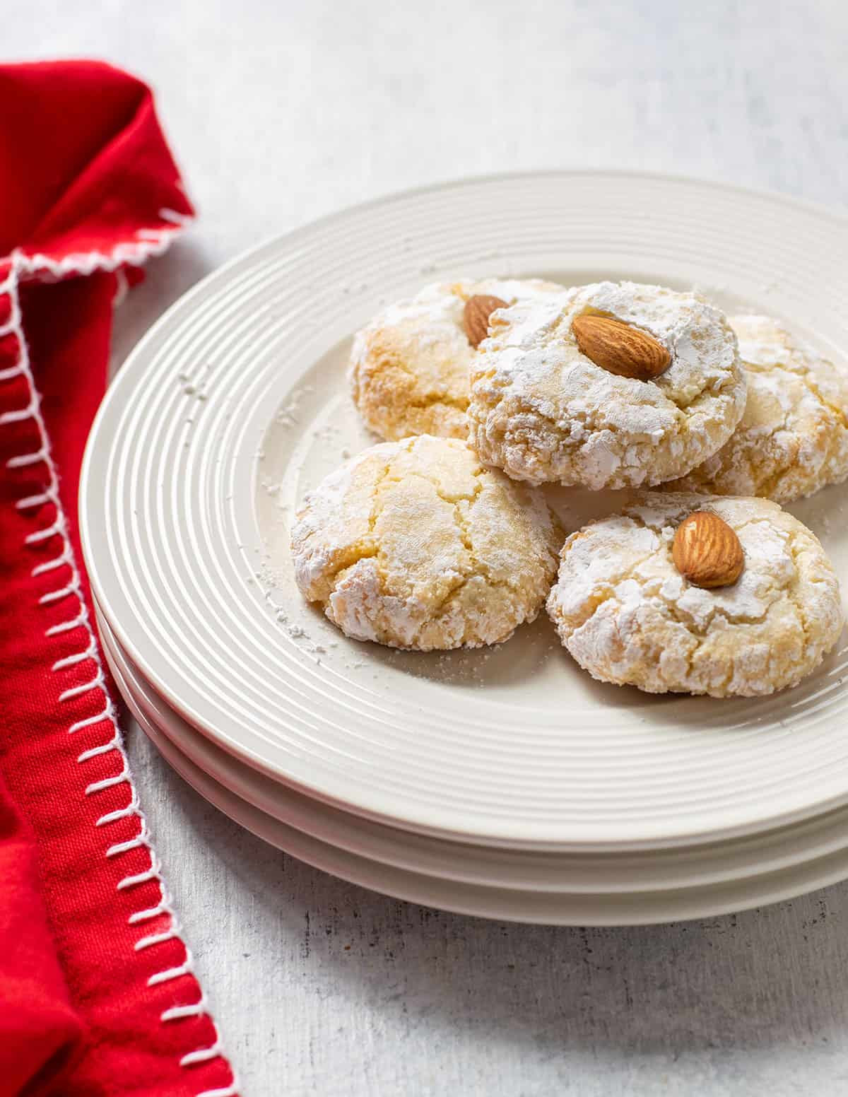 plate of amaretti cookies topped with almonds