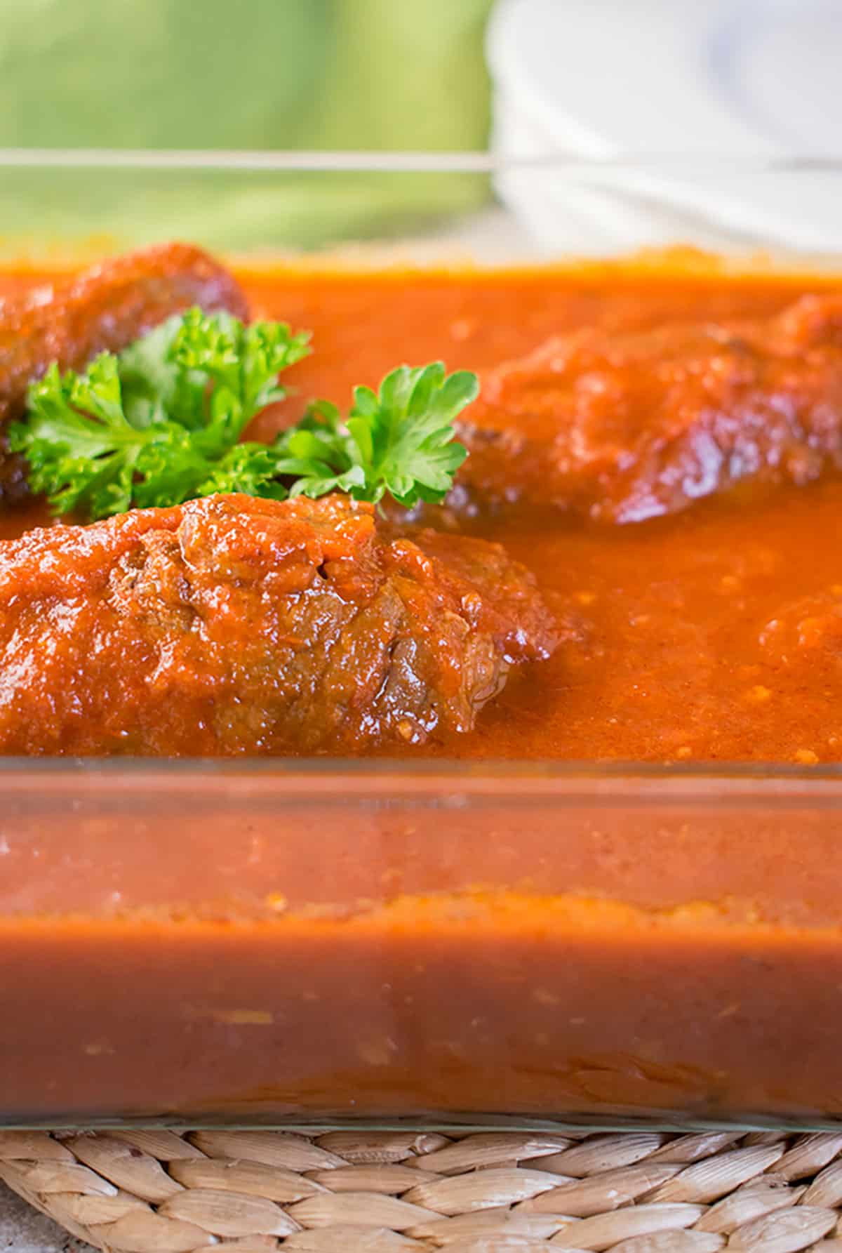braciole beef rolls in tomato sauce garnished with parsley