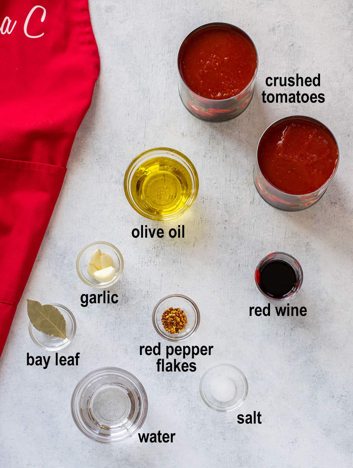 crushed tomatoes, oil, garlic, wine, bay leaf, pepper flakes, water, salt