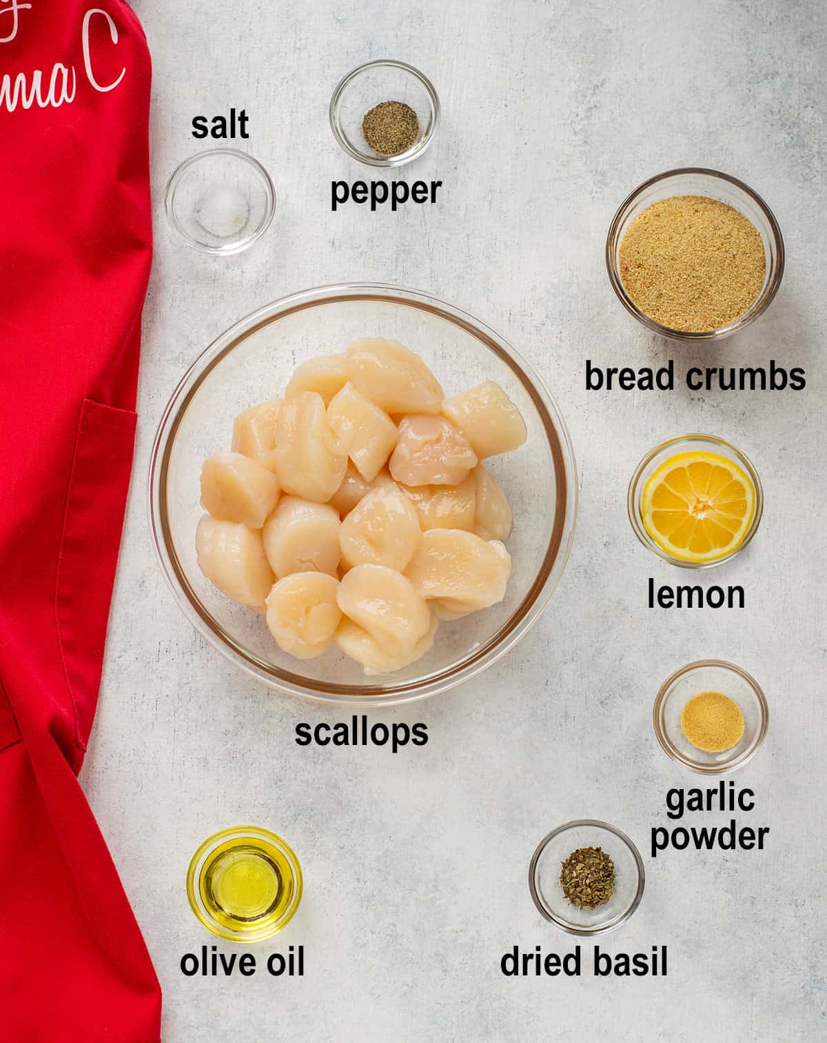 salt, pepper, bread crumbs, scallops, lemon, garlic powder, olive oil, dried basil