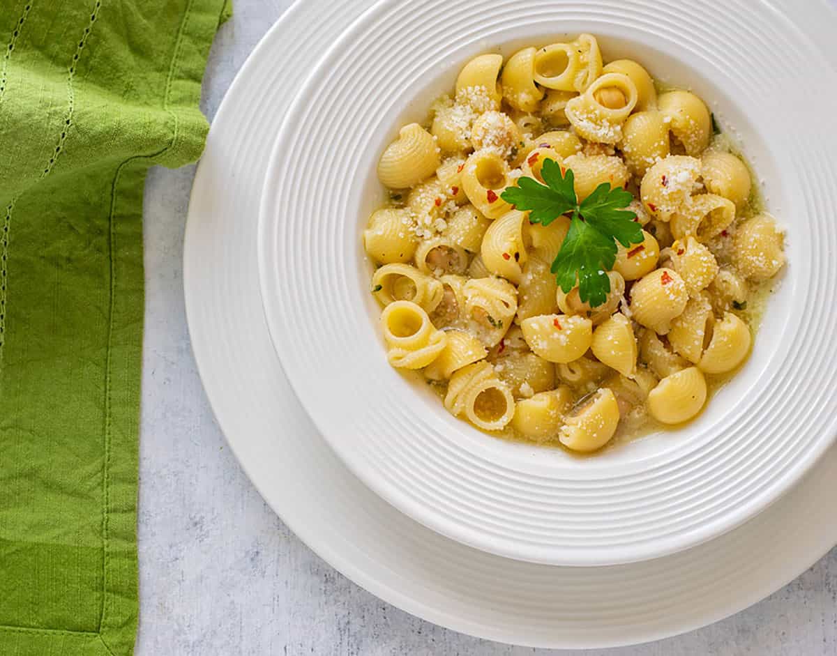 plate of pasta with chickpeas garnished with parsley